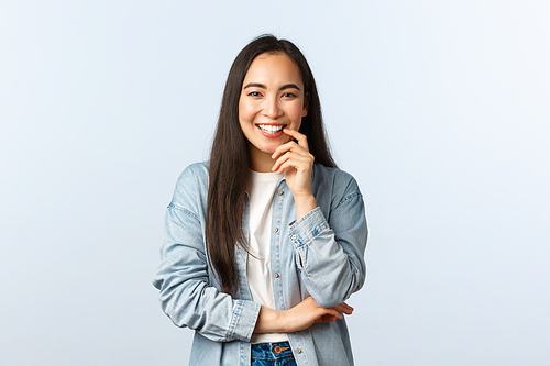 Lifestyle, people emotions and beauty concept. Enthusiastic attractive asian girl in casual clothes, laughing and smiling pleased, having conversation, lively talking to friends.