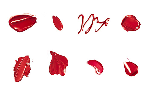 Red lipstick samples as beauty cosmetic texture isolated on white background, makeup smear or smudge as cosmetics product or paint strokes.