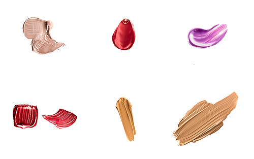 Set of art brush strokes or cosmetic makeup samples isolated on white background.