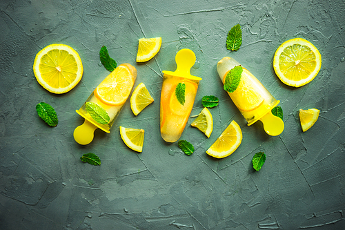 Summer dessert with lemon and mint on rustic wooden background with copyspace