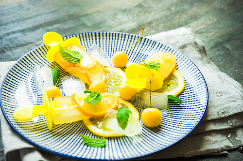 Summer dessert with lemon and mint on rustic wooden background with copyspace