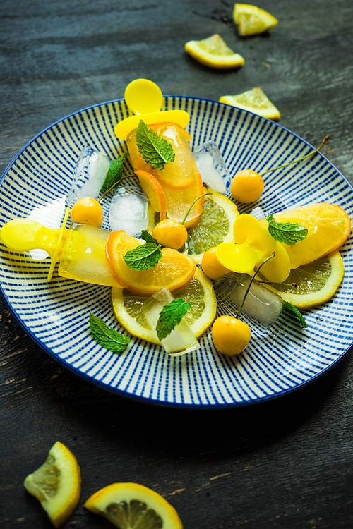 Summer dessert with lemon and mint on rustic wooden background with copyspace