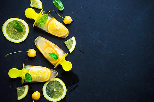 Summer dessert with lemon and mint on rustic wooden background with copyspace