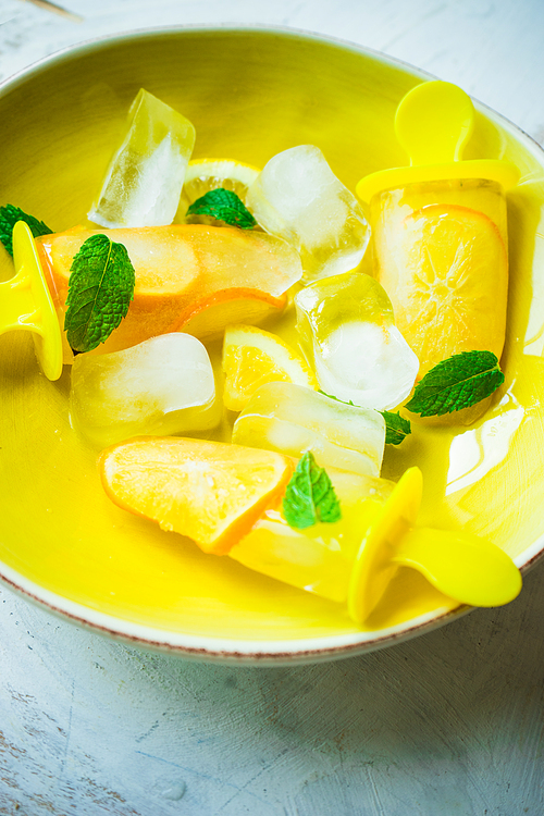 Summer dessert with lemon and mint on rustic wooden background with copyspace