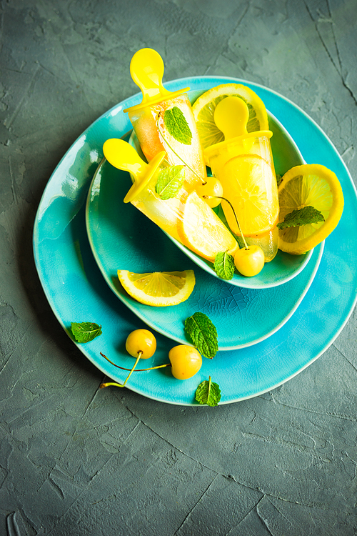 Summer dessert with lemon and mint on rustic wooden background with copyspace