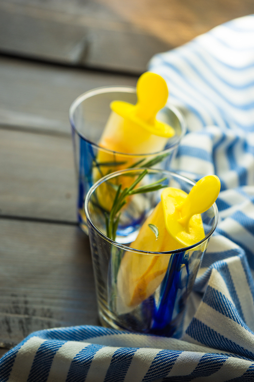 Summer dessert with lemon and mint on rustic wooden background with copyspace