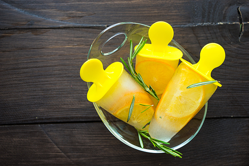 Summer dessert with lemon and mint on rustic wooden background with copyspace