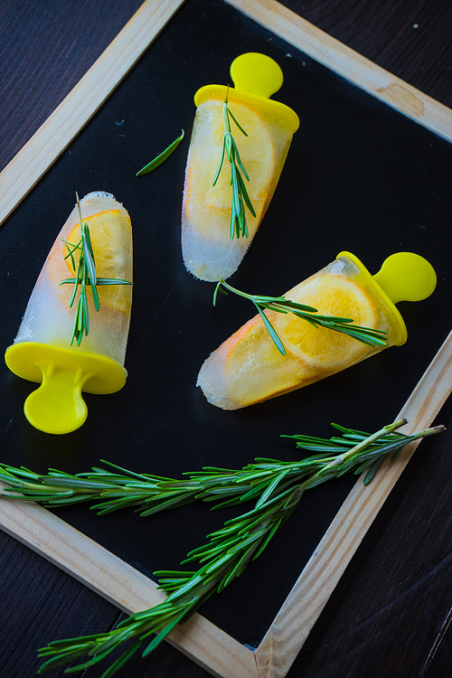 Summer dessert with lemon and mint on rustic wooden background with copyspace