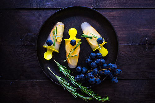 Summer dessert with lemon and mint on rustic wooden background with copyspace