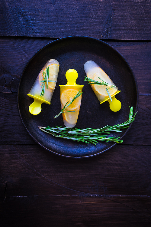 Summer dessert with lemon and mint on rustic wooden background with copyspace