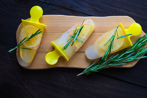 Summer dessert with lemon and mint on rustic wooden background with copyspace