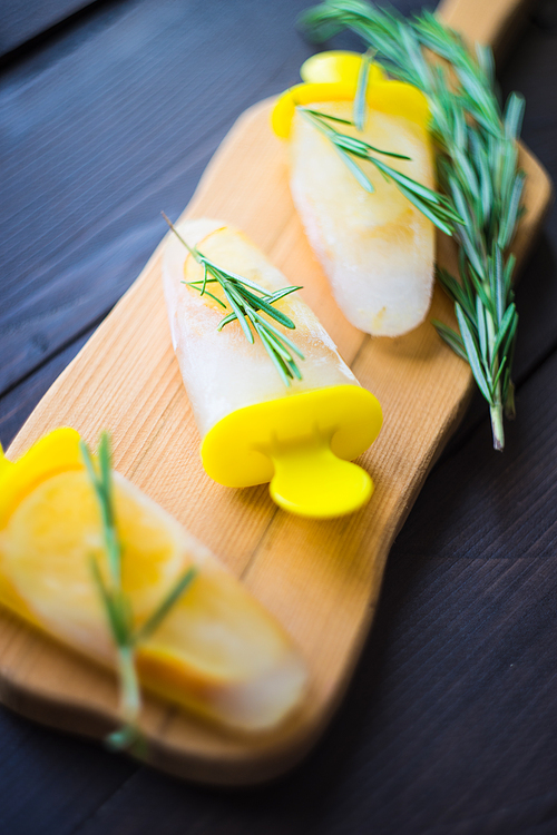 Summer dessert with lemon and mint on rustic wooden background with copyspace