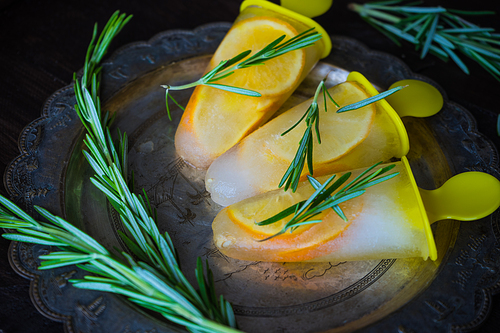 Summer dessert with lemon and mint on rustic wooden background with copyspace