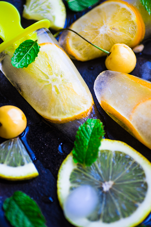 Summer dessert with lemon and mint on rustic wooden background with copyspace