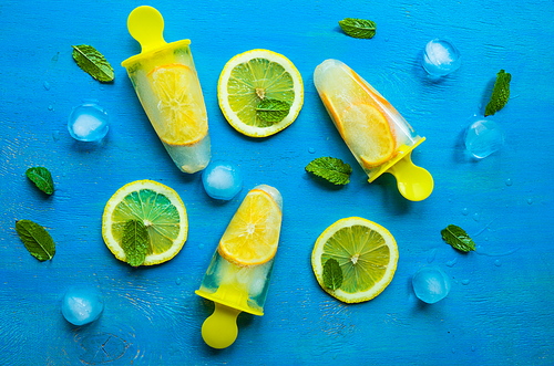 Summer dessert with lemon and mint on rustic wooden background with copyspace