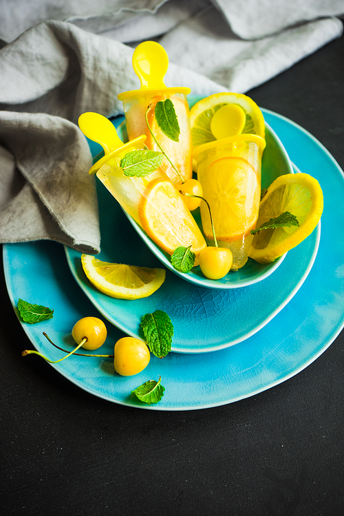 Summer dessert with lemon and mint on rustic wooden background with copyspace