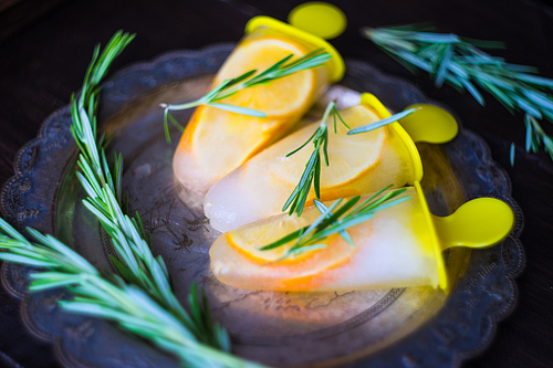 Summer dessert with lemon and mint on rustic wooden background with copyspace