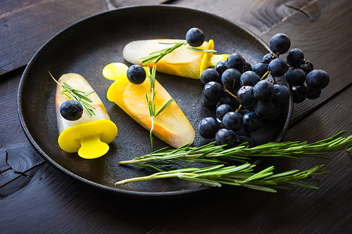 Summer dessert with lemon and mint on rustic wooden background with copyspace