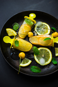 Summer dessert with lemon and mint on rustic wooden background with copyspace