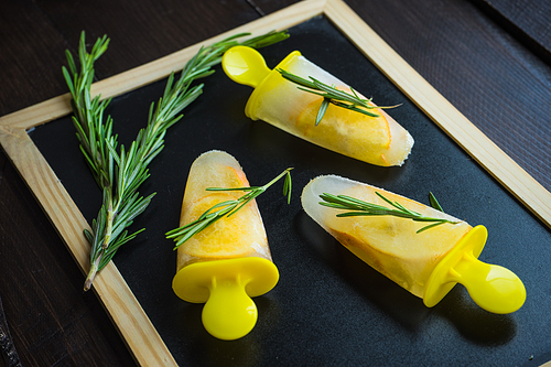 Summer dessert with lemon and mint on rustic wooden background with copyspace