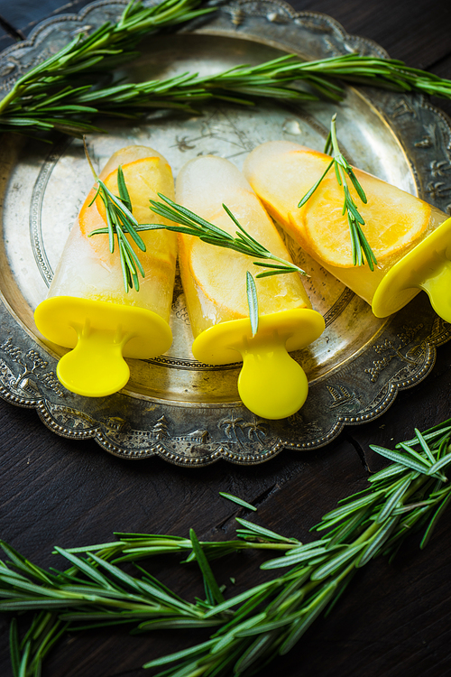 Summer dessert with lemon and mint on rustic wooden background with copyspace