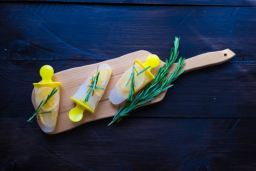 Summer dessert with lemon and mint on rustic wooden background with copyspace