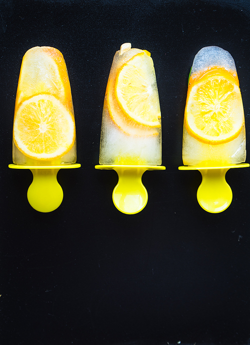 Summer dessert with lemon and mint on rustic wooden background with copyspace