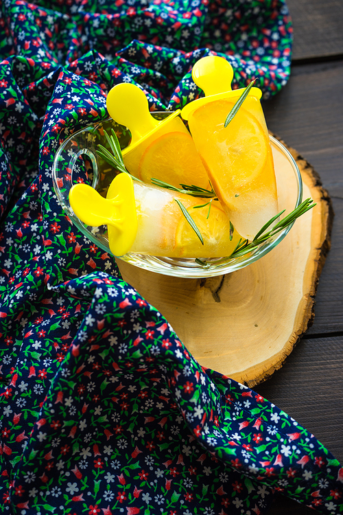 Summer dessert with lemon and mint on rustic wooden background with copyspace