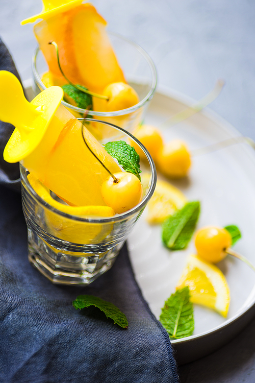 Summer dessert with lemon and mint on rustic wooden background with copyspace