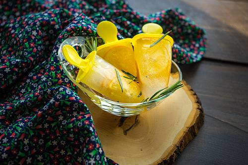 Summer dessert with lemon and mint on rustic wooden background with copyspace