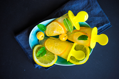 Summer dessert with lemon and mint on rustic wooden background with copyspace