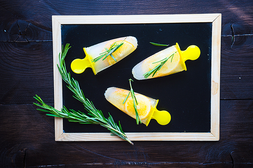 Summer dessert with lemon and mint on rustic wooden background with copyspace