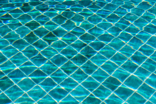 Blue swimming pool water texture reflection lighting