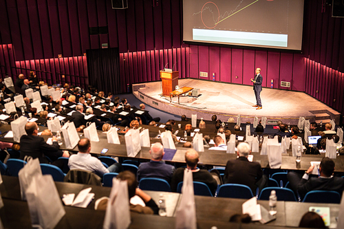 Speaker Giving a Talk at Business Meeting. Audience in the conference hall. Business and Entrepreneurship concept.