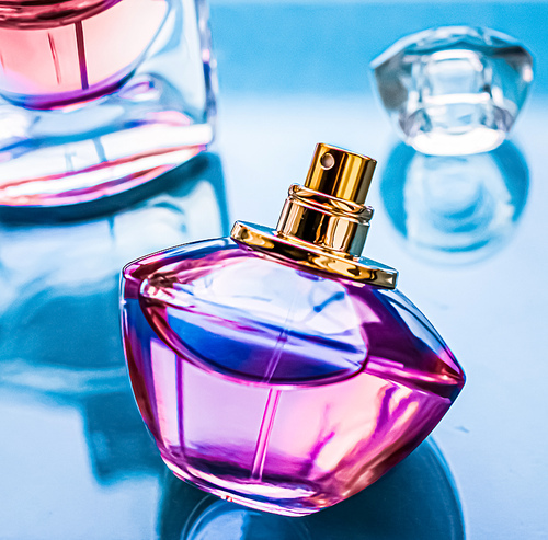 Perfume bottle on glossy background, sweet floral scent, glamour fragrance and eau de parfum as holiday gift and luxury beauty cosmetics brand design.