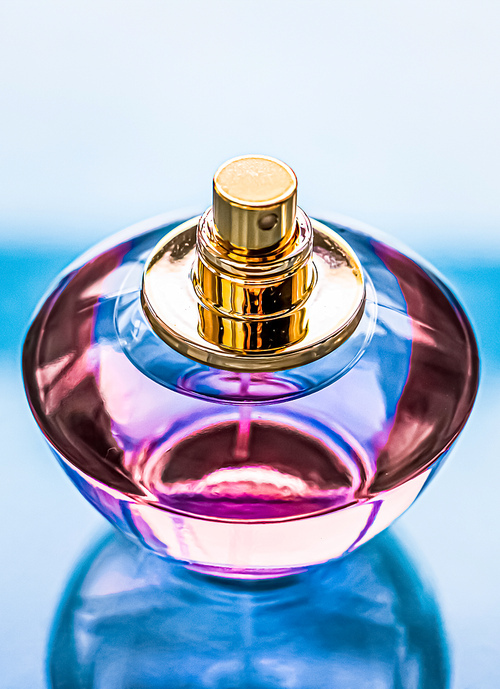 Perfume bottle on glossy background, sweet floral scent, glamour fragrance and eau de parfum as holiday gift and luxury beauty cosmetics brand design.