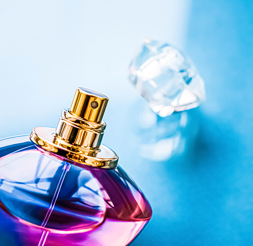 Perfume bottle on glossy background, sweet floral scent, glamour fragrance and eau de parfum as holiday gift and luxury beauty cosmetics brand design.