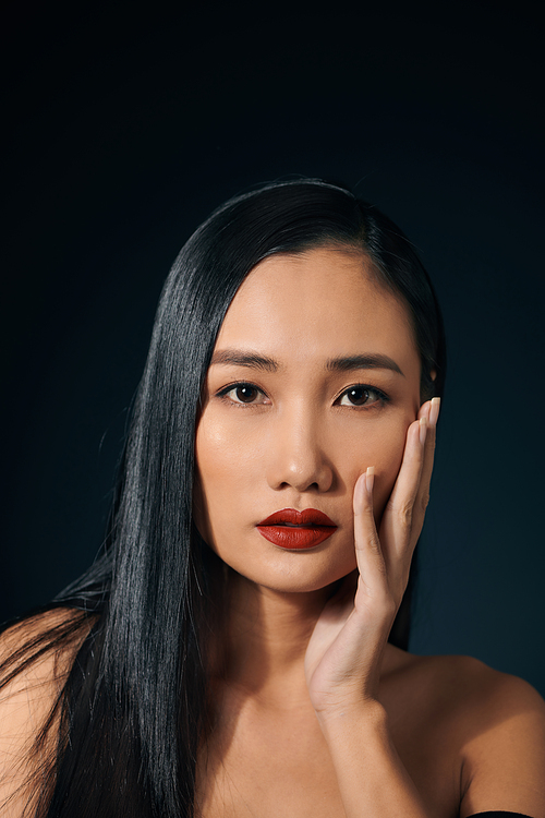 Closeup sexy Asian woman isolated over black background