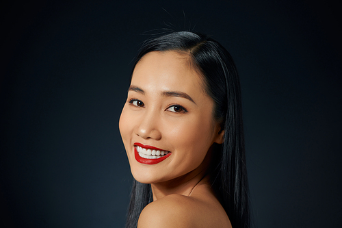 Portrait of Vietnamese young woman looking at the camera