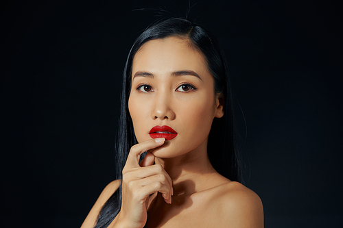 Portrait of Vietnamese young woman looking at the camera