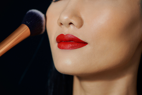 Beautiful woman is happy with makeup On a black background