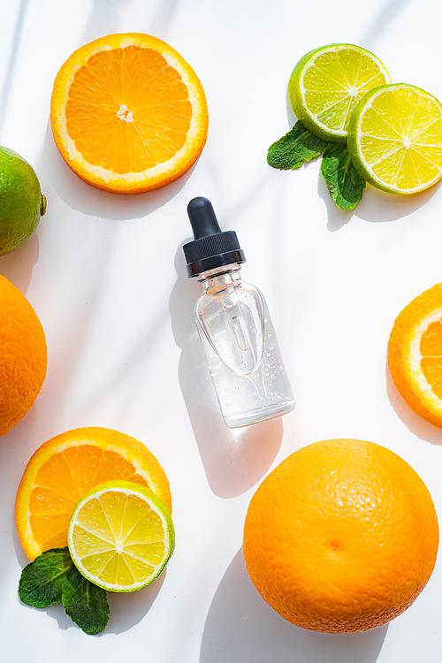 Hyaluronic acid and citrus fruits . Cosmetic procedures. Healthy skin. Skin care. Citrus oil. White background. Copy space. Article about care cosmetics