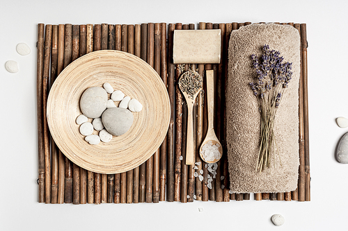 Flat lay composition with lavender flowers and natural cosmetic products on white marble background, skin care and eco friendly lifestyle concept