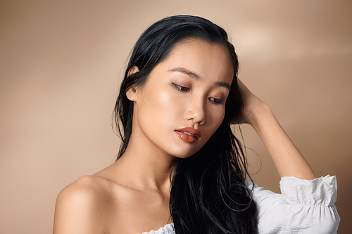 portrait of beautiful young asian woman with flawless skin and perfect make-up