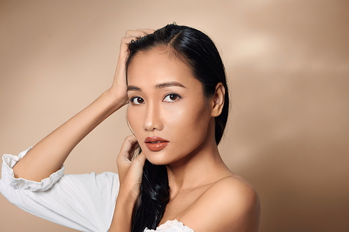 beauty headshot of sexy woman with bare shoulders