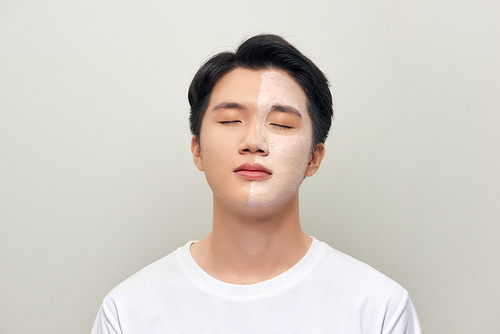 Male  wearing clay face mask beauty treatment.