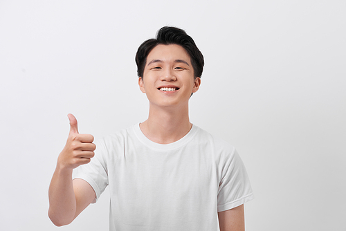 Happy man giving thumbs up sign portrait on white background