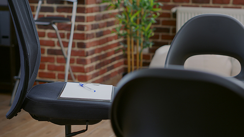 Close up of chairs in circle used for aa group meeting with people and therapist. Office with furniture designed for therapy session against alcoholism and drug addiction. Rehab space