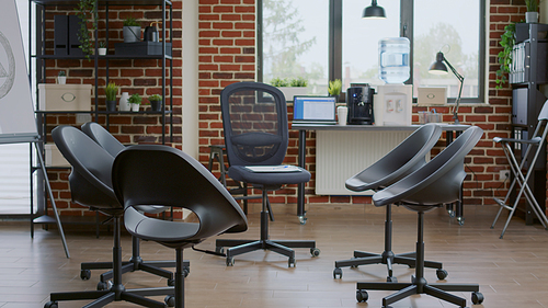 Nobody in office decorated with chairs in circle for aa meeting therapy with group of people. Empty space with furniture for support session with help of psychiatrist. Discussion room