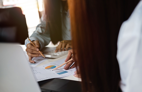 Close up business people discuss to working with using tablet and for searching information stock market chart for trading to Make a profit. Planning and Investment concept.